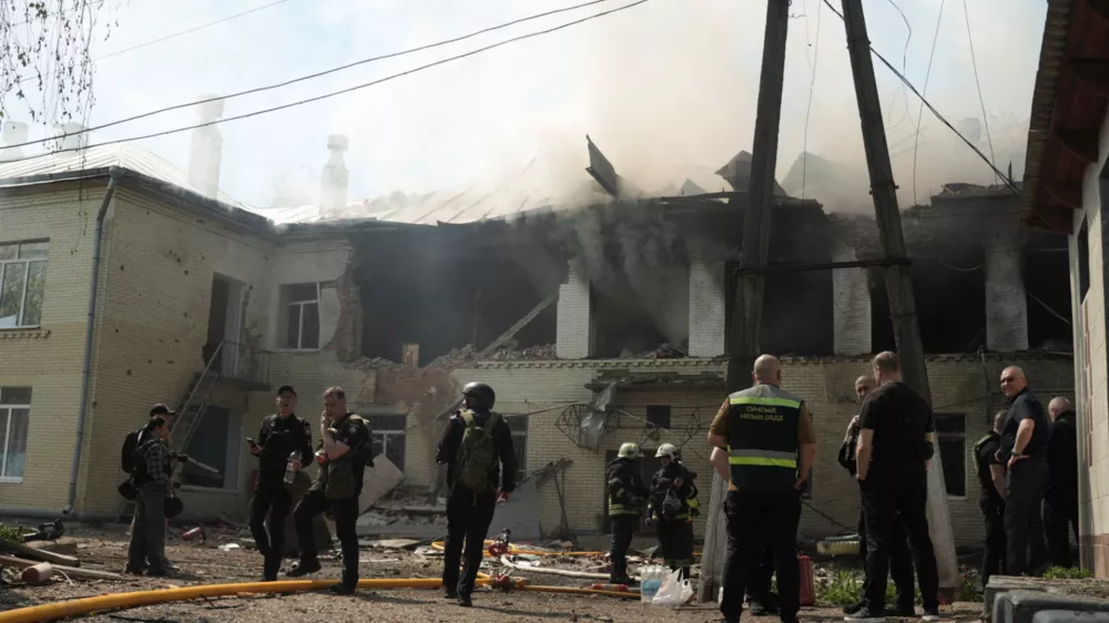 Rescuers work at the site of the kindergarten hit by a Russian drone strike, amid Russia's attack on Ukraine, in Sumy, Ukraine May 6, 2026. REUTERS/Stringer