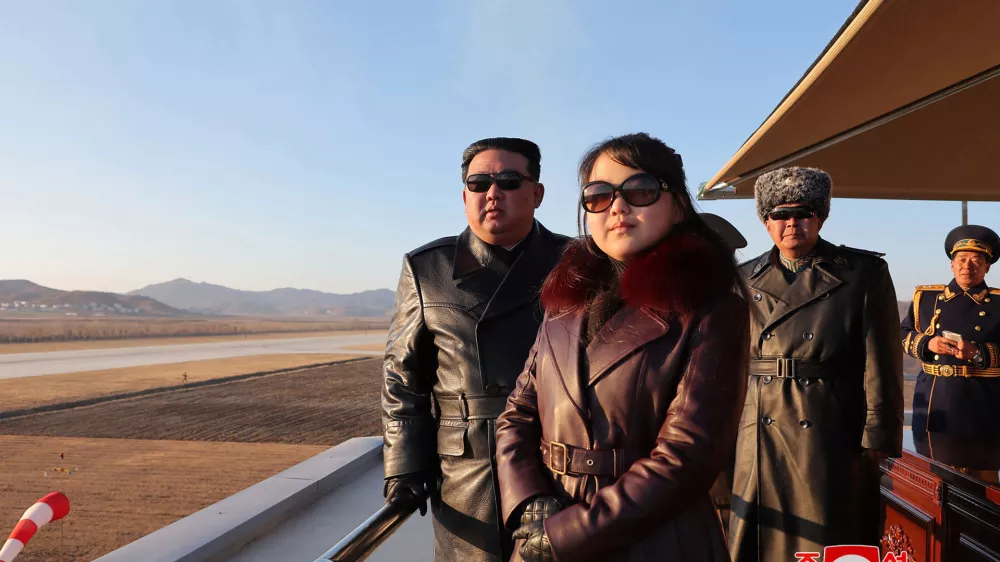 This picture taken on November 30, 2023 and released from North Korea's official Korean Central News Agency (KCNA) via KNS on December 1, 2023 shows North Korea's leader Kim Jong Un (L) and his daughter (C), presumed to be named Ju Ae, observing an air festival during a visit with the 1st Air Force Division Flying Regiment of the Korean People's Army to commemorate Air Day, at an unknown location.,Image: 825710791, License: Rights-managed, Restrictions: South Korea OUT / REPUBLIC OF KOREA OUT---EDITORS NOTE--- RESTRICTED TO EDITORIAL USE - MANDATORY CREDIT "AFP PHOTO/KCNA VIA KNS" - NO MARKETING NO ADVERTISING CAMPAIGNS - DISTRIBUTED AS A SERVICE TO CLIENTS / THIS PICTURE WAS MADE AVAILABLE BY A THIRD PARTY. AFP CAN NOT INDEPENDENTLY VERIFY THE AUTHENTICITY, LOCATION, DATE AND CONTENT OF THIS IMAGE ---, ***HANDOUT image or SOCIAL MEDIA IMAGE or FILMSTILL for EDITORIAL USE ONLY! * Please note: Fees charged by Profimedia are for the Profimedia's services only, and do not, nor are they intended to, convey to the user any ownership of Copyright or License in the material. Profimedia does not claim any ownership including but not limited to Copyright or License in the attached material. By publishing this material you (the user) expressly agree to indemnify and to hold Profimedia and its directors, shareholders and employees harmless from any loss, claims, damages, demands, expenses (including legal fees), or any causes of action or allegation against Profimedia arising out of or connected in any way with publication of the material. Profimedia does not claim any copyright or license in the attached materials. Any downloading fees charged by Profimedia are for Profimedia's services only. * Handling Fee Only ***, Model Release: no