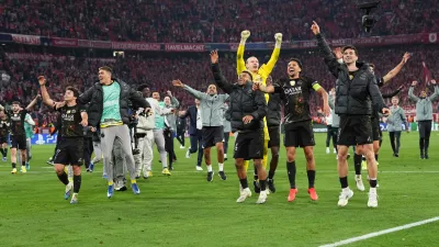 PSG players celebrate after the Champions League semifinal second leg soccer match between Bayern Munich and Paris Saint Germain in Munich, Germany, Wednesday, May 6, 2026. (AP Photo/Martin Meissner)