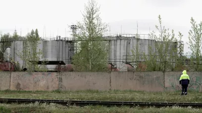 Oil tanks at the site where drones crashed at a storage facility in Rezekne, Latvia, May 7, 2026. REUTERS/Janis Laizans