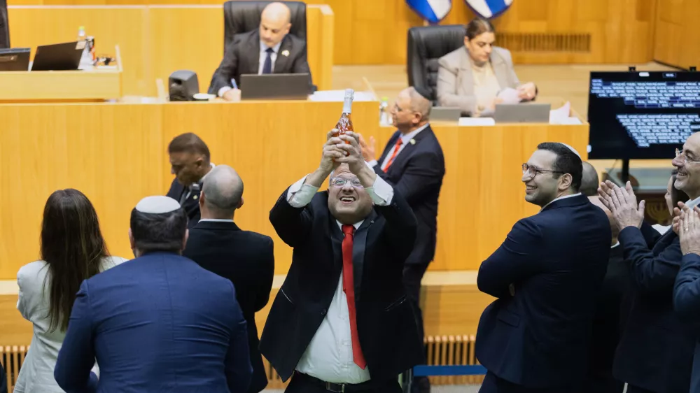 Israel's Minister of National Security, Itamar Ben-Gvir, center, and lawmakers celebrate after Israel's parliament passed a law approving the death penalty for Palestinians convicted of murdering Israelis, at the Knesset in Jerusalem Monday, March 30, 2026. (AP Photo/Itay Cohen)
