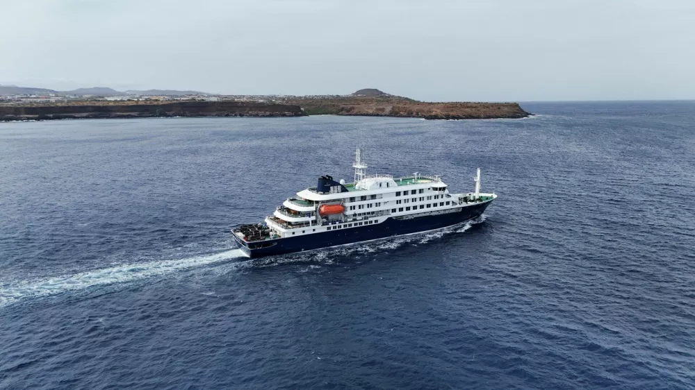 A drone view of the cruise ship MV Hondius, carrying passengers suspected of having cases of hantavirus on board, leaves Praia, Cape Verde, May 6, 2026. REUTERS/Stringer