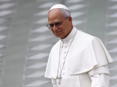 Pope Leo XIV walks after delivering his speech during the swearing-in ceremony of new Swiss Guards in the Paul VI Hall at the Vatican, May 6, 2026. REUTERS/Guglielmo Mangiapane