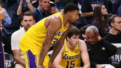 Los Angeles Lakers' Marcus Smart, center, Luka Doncic, left rear, and Austin Reaves (15) sit on the bench watching play late in the second half of Game 2 in a second-round NBA basketball playoffs series against the Oklahoma City Thunder Thursday, May 7, 2026, in Oklahoma City. (AP Photo/Nate Billings)