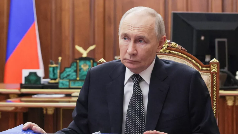 Russian President Vladimir Putin listens to the governor of Tambov region Evgeny Pervyshov at the Kremlin in Moscow, Wednesday, May 6, 2026. (Mikhail Metzel, Sputnik, Kremlin Pool Photo via AP)
