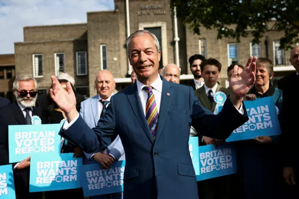Britain's Reform UK leader Nigel Farage reacts next to newly elected councillors at the Havering Town Hall, following the results of the local elections, in the London Borough of Havering, Britain, May 8, 2026. REUTERS/Jack Taylor   TPX IMAGES OF THE DAY