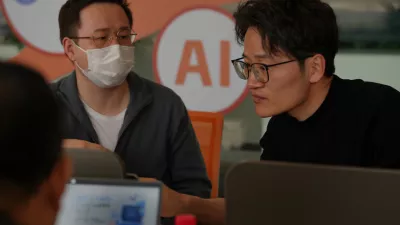 People install RedClaw AI software on their laptops in Beijing on March 22, 2026. (AP Photo/Andy Wong)