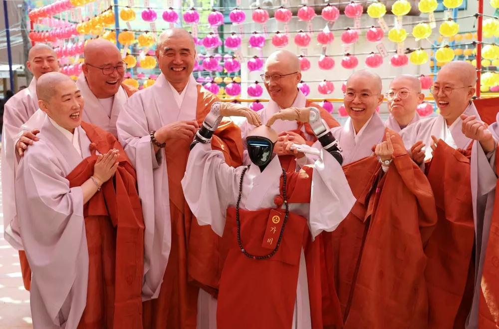 Humanoid robot Gabi poses for photographs during a precept ceremony at a temple in Seoul, South Korea, May 6, 2026.  Yonhap via REUTERS  THIS IMAGE HAS BEEN SUPPLIED BY A THIRD PARTY. NO RESALES. NO ARCHIVES. SOUTH KOREA OUT. NO COMMERCIAL OR EDITORIAL SALES IN SOUTH KOREA.