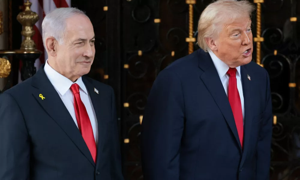 U.S. President Donald Trump speaks next to Israeli Prime Minister Benjamin Netanyahu upon arrival for meetings at Trump's Mar-a-Lago club in Palm Beach, Florida, U.S., December 29, 2025. REUTERS/Jonathan Ernst