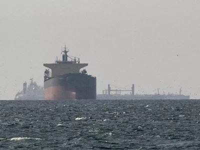FILE PHOTO: Cargo ships in the Gulf, near the Strait of Hormuz, as seen from northern Ras al-Khaimah, near the border with Oman's Musandam governance, amid the U.S.-Israeli conflict with Iran, in United Arab Emirates, March 11, 2026./File Photo