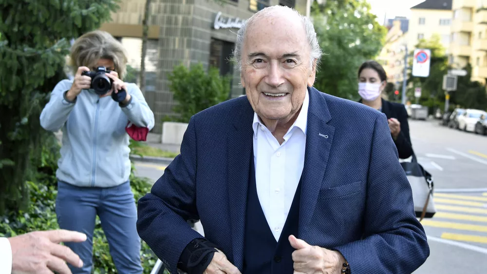 Former FIFA President Sepp Blatter, front, on the way to the Federal Prosecutor's Office in Zurich, Switzerland, Monday, Aug. 9, 2021. Sepp Blatter, faces his final hearing with a Swiss prosecutor on Monday in a fraud probe surrounding a 2011 FIFA payment to Michel Platini. (Walter Bieri/Keystone via AP)