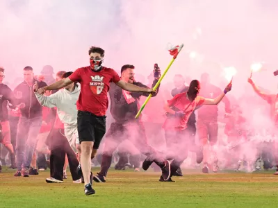 Fans get onto the pitch during the Czech league soccer derby match between Sparta Prague and Slavia Prague in Prague, Saturday, May 9, 2026. (Michal Kamaryt/CTK via AP)