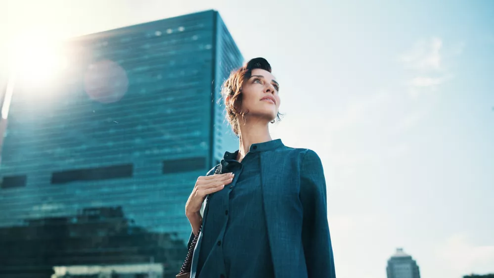 Sunshine, thinking and business woman in city with idea, brainstorming and career insights. Professional, corporate and person with inspiration for company future, urban development and opportunity
