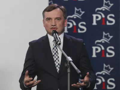 FILE - The current Poland's justice minister Zbigniew Ziobro, speaks to reporters alongside in Warsaw, Poland, Saturday, Sept. 26, 2020. Poland's divisive justice minister, Zbigniew Ziobro, has drawn surprised comments after a gust of wind revealed that he carries a gun tucked in his belt. (AP Photo/Czarek Sokolowski, File)
