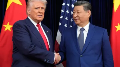 FILE - President Donald Trump, left, and Chinese President Xi Jinping shake hands before their meeting at Gimhae International Airport in Busan, South Korea, Oct. 30, 2025. (AP Photo/Mark Schiefelbein, File)