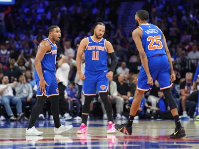 May 10, 2026; Philadelphia, Pennsylvania, USA; New York Knicks guard Miles McBride (2) reacts with guard Jalen Brunson (11) and guard Mikal Bridges (25) against the Philadelphia 76ers in the first quarter during game four of the second round of the 2026 NBA Playoffs at Xfinity Mobile Arena. Mandatory Credit: Kyle Ross-Imagn Images
