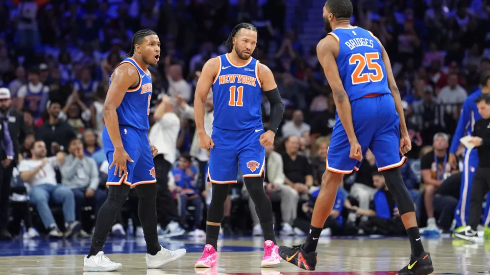 May 10, 2026; Philadelphia, Pennsylvania, USA; New York Knicks guard Miles McBride (2) reacts with guard Jalen Brunson (11) and guard Mikal Bridges (25) against the Philadelphia 76ers in the first quarter during game four of the second round of the 2026 NBA Playoffs at Xfinity Mobile Arena. Mandatory Credit: Kyle Ross-Imagn Images
