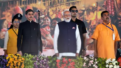 Indian Prime Minister Narendra Modi, centre, R. N. Ravi, Governor of West Bengal and Subhendu Adhikari, Chief Minister designate Bharatiya Janata Party leader stand for the national anthem prior to the oath taking ceremony in Kolkata, India, Saturday, May 9, 2026. (AP Photo/Bikas Das)
