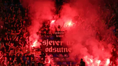 Soccer Football - Champions League - Qualifying Third Round - First Leg - Dinamo Zagreb v AEK Athens - Maksimir stadium, Zagreb, Croatia - August 15, 2023 Dinamo Zagreb fans with flares and a banner reading "hold on brothers" in the stands REUTERS/Antonio Bronic
