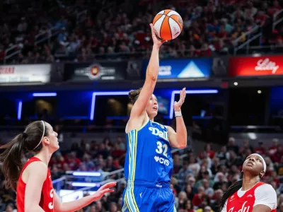 May 9, 2026; Indianapolis, Indiana, USA; Dallas Wings forward Jessica Shepard (32) shoots the ball while Indiana Fever forward Myisha Hines-Allen (2) defends in the second half at Gainbridge Fieldhouse. Mandatory Credit: Trevor Ruszkowski-Imagn Images