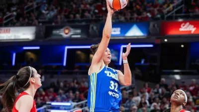 May 9, 2026; Indianapolis, Indiana, USA; Dallas Wings forward Jessica Shepard (32) shoots the ball while Indiana Fever forward Myisha Hines-Allen (2) defends in the second half at Gainbridge Fieldhouse. Mandatory Credit: Trevor Ruszkowski-Imagn Images