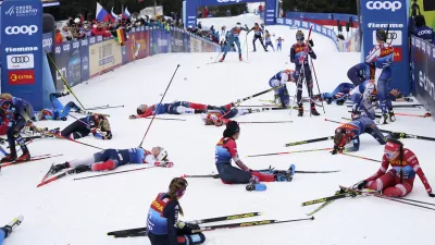 Participants recover at the finish line during the Women's Mass Start Free 10km event at the Tour de Ski in Val di Fiemme, Trento, Italy, Tuesday, Jan. 4, 2022. (AP Photo/Giovanni Auletta)