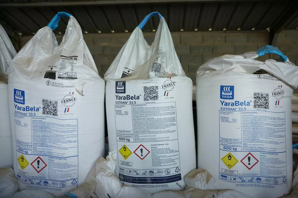Bags of YaraBela's nitrogen fertilizers white pellets are seen in a French farmer's barn in Arville, France, May 7, 2026. REUTERS/Alice Sacco