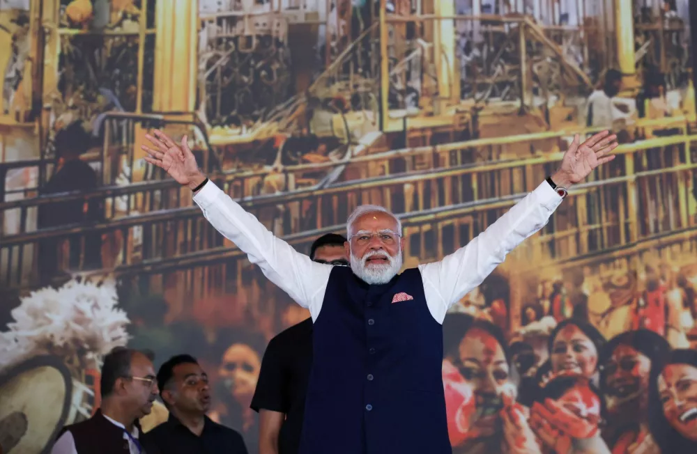 India's Prime Minister Narendra Modi gesutres as he attends a swearing-in ceremony of Suvendu Adhikari as the Chief Minister of West Bengal, at the Brigade Parade Ground in Kolkata, India, May 9, 2026. REUTERS/Sahiba Chawdhary