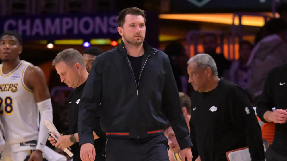 May 9, 2026; Los Angeles, California, USA; Los Angeles Lakers guard Luka Doncic (77) looks on from the bench in the final minutes of game three of the second round of the 2026 NBA Playoffs against the Oklahoma City Thunder at Crypto.com Arena. Mandatory Credit: Jayne Kamin-Oncea-Imagn Images