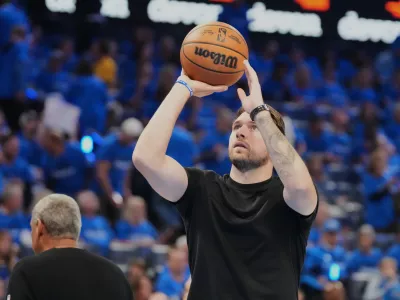 Los Angeles Lakers' Luka Doncic takes a shot during a time out from play in the second half of Game 1 in a second-round NBA basketball playoffs series against the Oklahoma City Thunder Tuesday, May 5, 2026 in Oklahoma City. (AP Photo/Kyle Phillips)