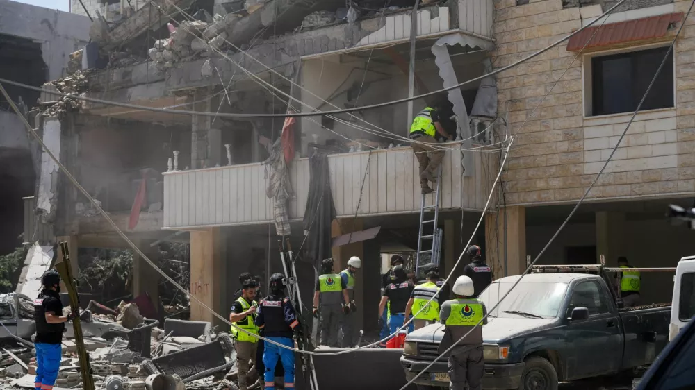 Rescuers work at the site of an Israeli strike in Kfar Jouz, Lebanon, May 11, 2026. REUTERS/Stringer