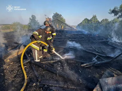 Firefighters work at the site of a kindergarten damaged during a Russian drone strike, amid Russia's attack on Ukraine, in Kyiv region, Ukraine May 12, 2026. Press service of the State Emergency Service of Ukraine in Kyiv region/Handout via REUTERS ATTENTION EDITORS - THIS IMAGE HAS BEEN SUPPLIED BY A THIRD PARTY. WATERMARK FROM SOURCE. MANDATORY CREDIT. BEST QUALITY AVAILABLE.