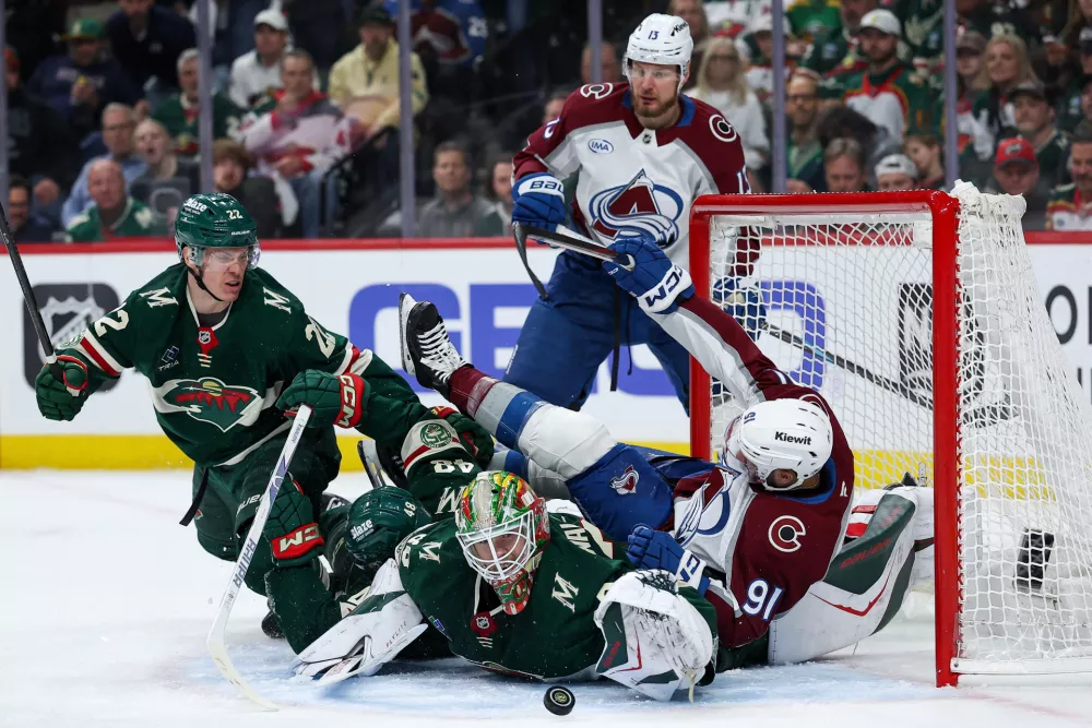 May 11, 2026; Saint Paul, Minnesota, USA; Minnesota Wild goaltender Jesper Wallstedt (30) reaches for the puck against the Colorado Avalanche during the third period in game four of the second round of the 2026 Stanley Cup Playoffs at Grand Casino Arena. Mandatory Credit: Matt Krohn-Imagn Images