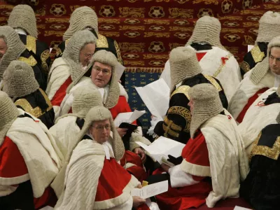 Law Lords sit on the cross benches, as they wait to hear the Queen's Speech in the House of Lords during the State Opening of Parliament, London November 6, 2007. Prime Minister Gordon Brown unveiled proposals on Tuesday to toughen anti-terrorism measures and address a crippling housing shortage in a new policy platform meant to revive Labour. REUTERS/Alastair Grant/Pool   (BRITAIN)