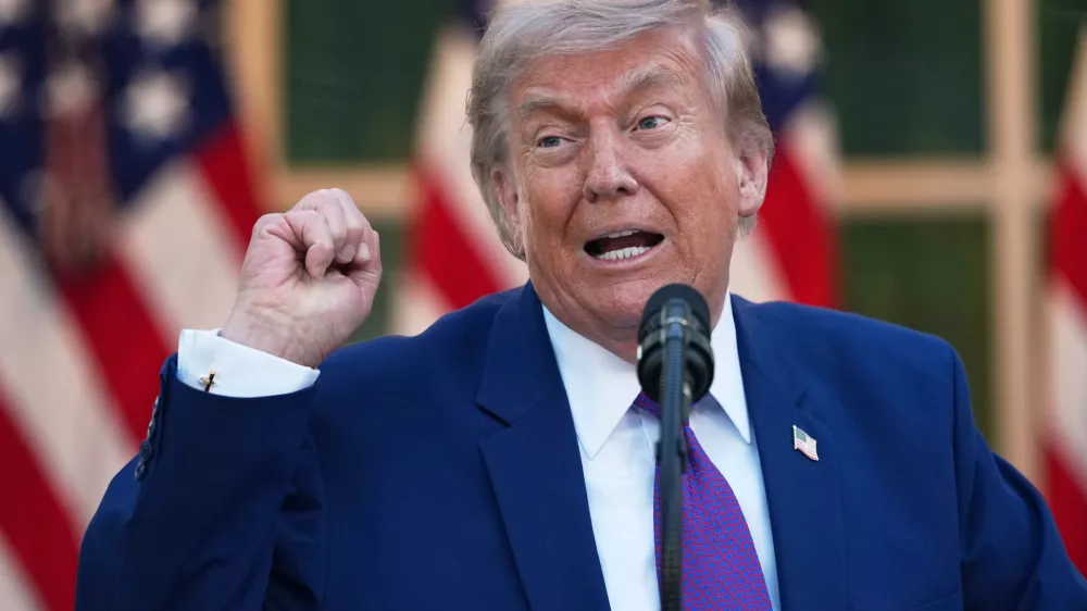 President Donald Trump speaks at a dinner for members of his administration and law enforcement organization leaders, during National Police Week, in the White House Rose Garden, Monday, May 11, 2026, in Washington. (AP Photo/Julia Demaree Nikhinson)