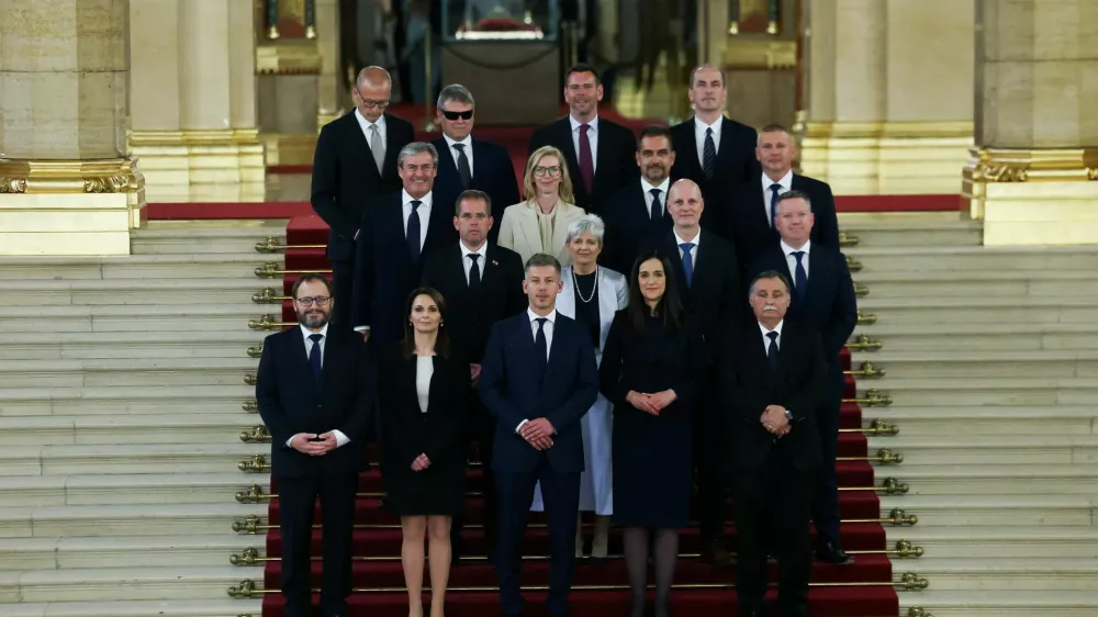 Hungarian Prime Minister Peter Magyar and new members of government, Finance Minister Andras Karman, Minister of Regional and Rural Development Viktoria Lorinc, Foreign Minister Anita Orban, Minister for the Living Environment Laszlo Gajdos, PM's Chief of Staff Balint Ruff, Children and Education Minister Judit Lannert, Science and Technology Minister Zoltan Tanacs, Interior Minister Posfai Gabor, Economy and Energy Affairs Minister Istvan Kapitany, Justice Minister Marta Gorog, Agriculture and Food Minister Szabolcs Bona, Defence Minister Romulusz Ruszin-Szendi, Social Relations and Culture Minister Zoltan Tarr, Social and Family Affairs Minister Vilmos Katai-Nemeth, Minister of Transport and Investment David Vitezy and Health Minister Zsolt Hegedus, pose for a family photo in the Parliament, in Budapest, Hungary, May 12, 2026. REUTERS/Bernadett Szabo   TPX IMAGES OF THE DAY