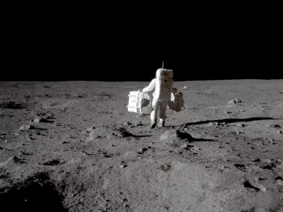 FILE PHOTO: Apollo 11 lunar module pilot Buzz Aldrin carries equipment for the Passive Seismic Experiments (in his left hand) and the Laser Ranging Retroreflector (in his right) to the deployment area at Tranquility Base in the Sea of Tranquility on the moon, July 20, 1969. Neil Armstrong/NASA/Handout via REUTERS/File Photo  ATTENTION EDITORS - THIS IMAGE HAS BEEN SUPPLIED BY A THIRD PARTY.  PLEASE SEARCH "50TH ANNIVERSARY OF THE MOON LANDING" FOR ALL PICTURES