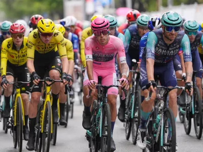 Portugal's Afonso Oliveira Eulalio wears the pink jersey of the race overall leader as he pedals in the pack, during the 6th stage of the Giro d'Italia cycling race, from Paestum to Naples, Italy, Thursday, May 14, 2026. (Fabio Ferrari/LaPresse via AP)