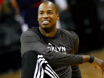 FILE - Brooklyn Nets center Jason Collins warms up before an NBA basketball game in New Orleans, March 24, 2014. (AP Photo/Jonathan Bachman, File)