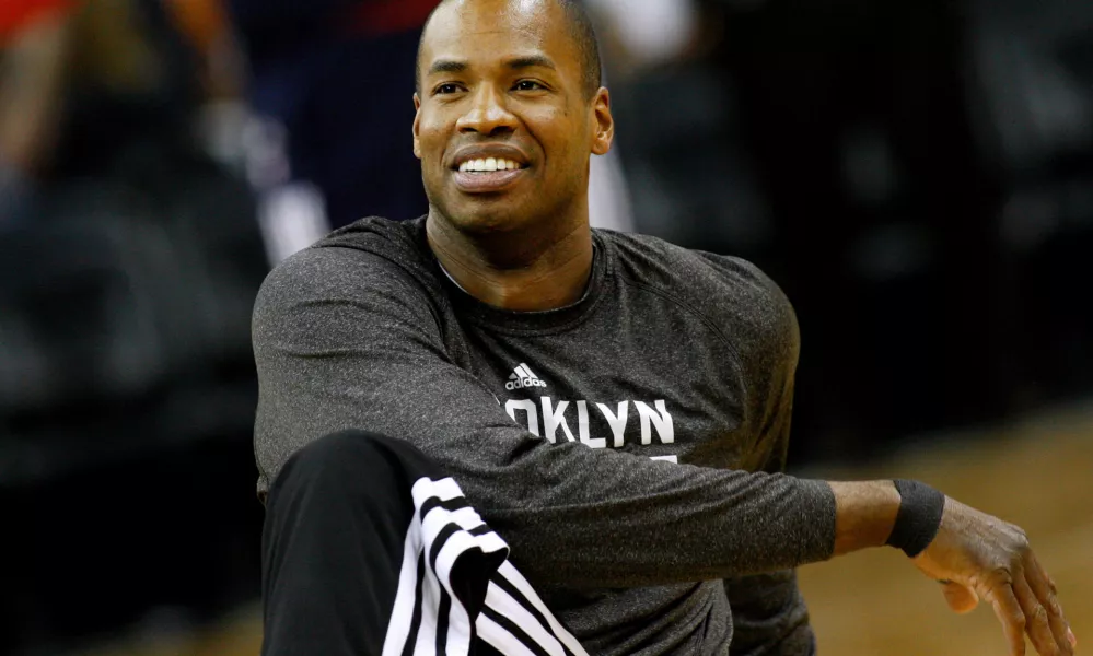FILE - Brooklyn Nets center Jason Collins warms up before an NBA basketball game in New Orleans, March 24, 2014. (AP Photo/Jonathan Bachman, File)