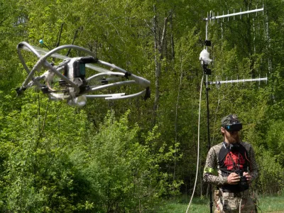 A recruit of Ukraine's 58th Mechanized Brigade practices military skills with an FPV drone at a training ground near the frontline in the Kharkiv region, Ukraine, Tuesday, May 12, 2026. (AP Photo/Andrii Marienko)