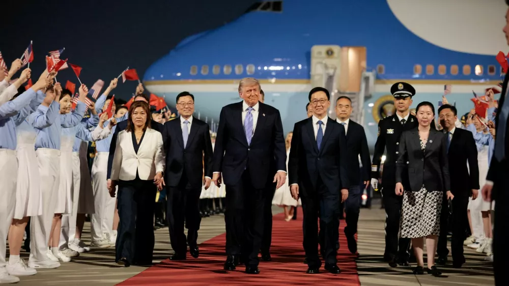 U.S. President Donald Trump walks with Chinese Vice President Han Zheng during an arrival ceremony at Beijing Capital International Airport, in Beijing, China, May 13, 2026. REUTERS/Evan Vucci