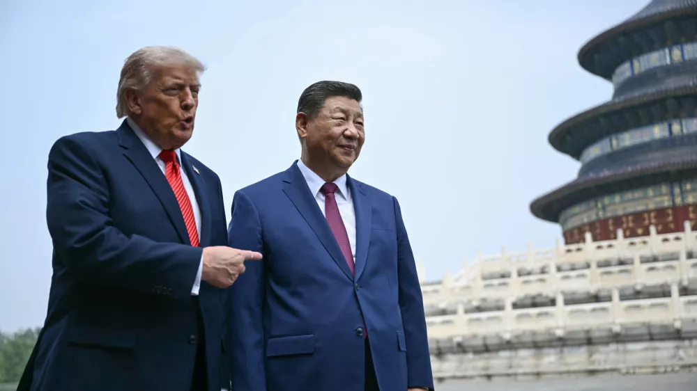 China's President Xi Jinping, right, and U.S. President Donald Trump visit the Temple of Heaven in Beijing Thursday, May 14, 2026. (Brendan Smialowski/Pool Photo via AP)