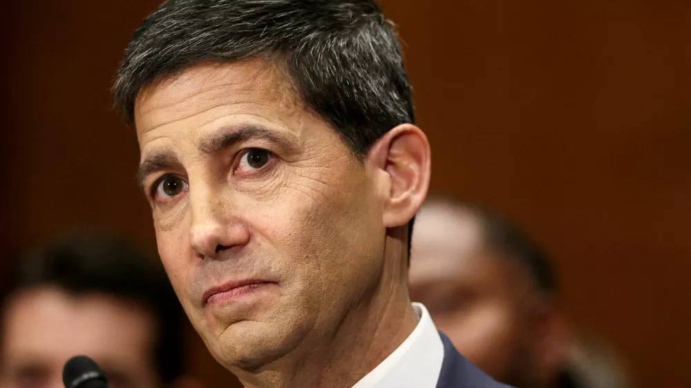 FILE PHOTO: Kevin Warsh, U.S. President Donald Trump's nominee to be next chair of the Federal Reserve, testifies before a Senate Banking Committee confirmation hearing on Capitol Hill in Washington, D.C., U.S., April 21, 2026. REUTERS/Kevin Lamarque/File Photo