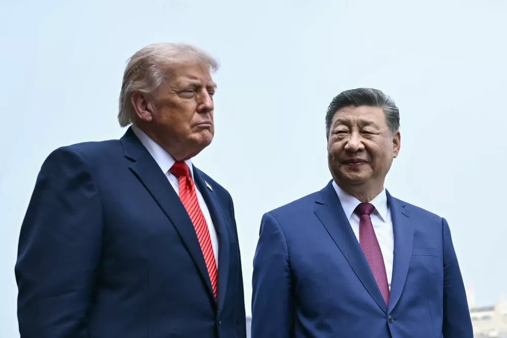 China's President Xi Jinping, right, and U.S. President Donald Trump visit the Temple of Heaven in Beijing Thursday, May 14, 2026. (Brendan Smialowski/Pool Photo via AP)