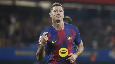 Barcelona's Robert Lewandowski celebrates scoring his side's 5th goal during a Spanish La Liga soccer match between FC Barcelona and Valencia at the Johan Cruyff stadium in Barcelona, Spain, Sunday, Sept. 14, 2025. (AP Photo/Joan Monfort)