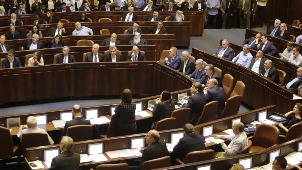 Israeli Ministers and Parliament Members in their chairs before voting in the Knesset, Israel's parliament in Jerusalem, Wednesday, May 29, 2019. Israel's parliament has voted to dissolve itself, sending the country to an unprecedented second snap election this year as Prime Minister Benjamin Netanyahu failed to form a governing coalition before a midnight deadline. (AP Photo/Sebastian Scheiner)