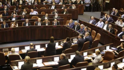 Israeli Ministers and Parliament Members in their chairs before voting in the Knesset, Israel's parliament in Jerusalem, Wednesday, May 29, 2019. Israel's parliament has voted to dissolve itself, sending the country to an unprecedented second snap election this year as Prime Minister Benjamin Netanyahu failed to form a governing coalition before a midnight deadline. (AP Photo/Sebastian Scheiner)