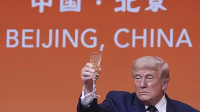 President Donald Trump proposes a toast during a state dinner with China's President Xi Jinping at the Great Hall of the People on Thursday May 14, 2026, in Beijing. (AP Photo/Mark Schiefelbein)