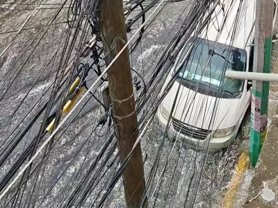 Water from a leak floods a street in Iztapalapa, Mexico City, Mexico, May 13, 2026, in this picture obtained from social media video. Luis Bella/via REUTERS THIS IMAGE HAS BEEN SUPPLIED BY A THIRD PARTY. MANDATORY CREDIT. NO RESALES. NO ARCHIVES.